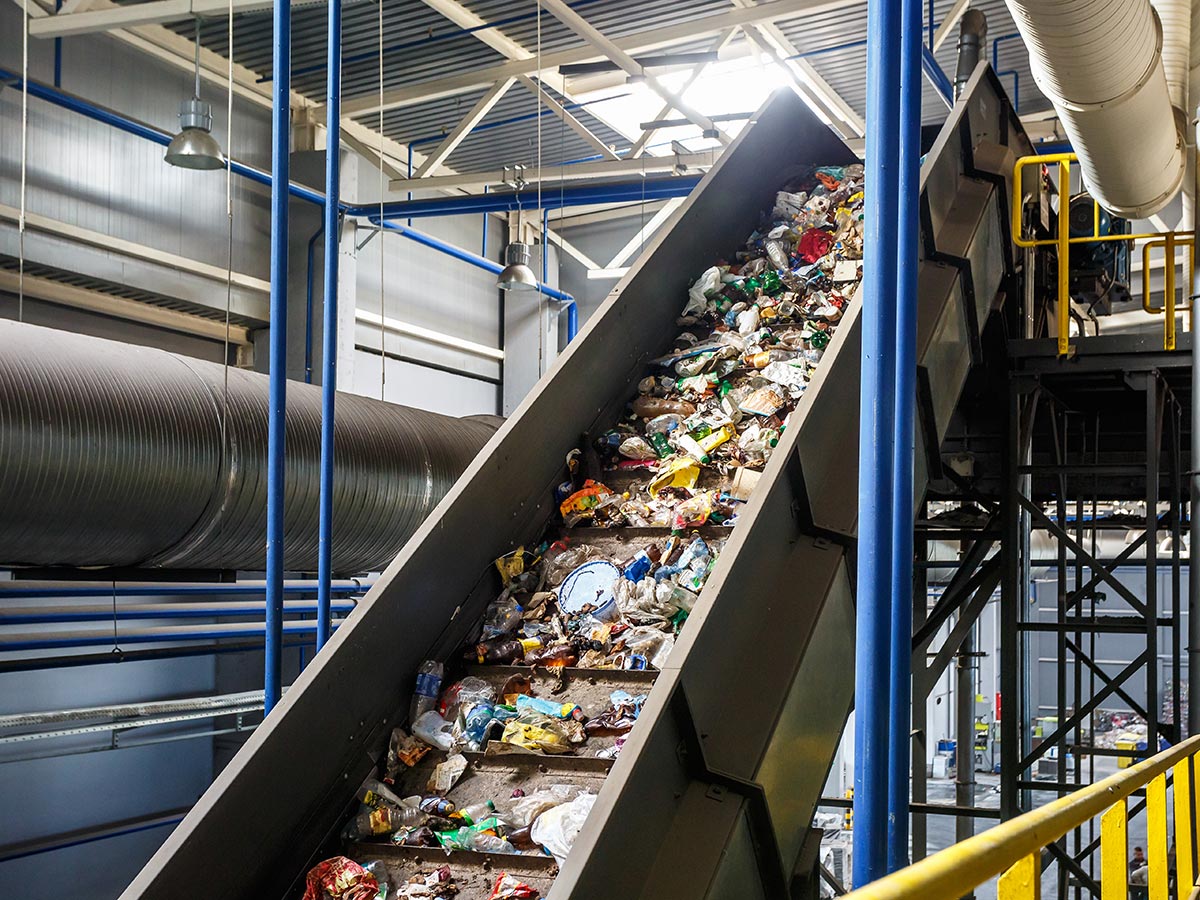 A conveyor belt in a recycling facility carrying materials for testing